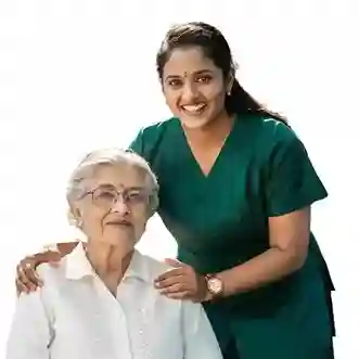 Smiling female nurse standing beside elderly woman – home health care services in Chennai
