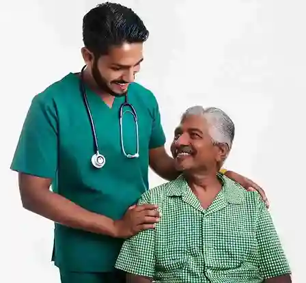 Smiling male nurse providing home care support to senior man – home health care services in Chennai